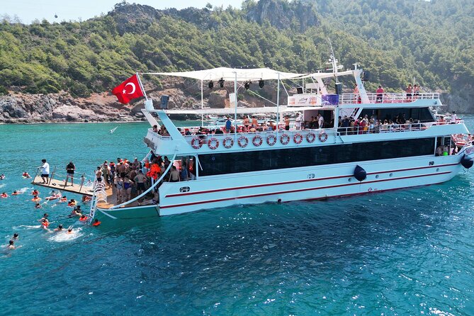 Alanya Boat Trip w/Unlimited Drinks & Lunch (Free Hotel Transfer) - Leaving the harbor beside Alanya’s old walls