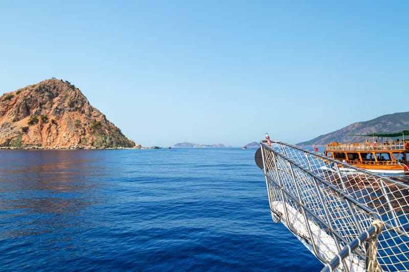 Antalya/Kemer: Suluada & Adrasan Boat Trip with Lunch - Leaving Adrasan Bay and following the cliffs