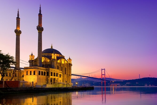 Bosphorus Evening Cruise: Dinner, Live Shows & Private Table - Dolmabahçe Palace glowing along the European shore