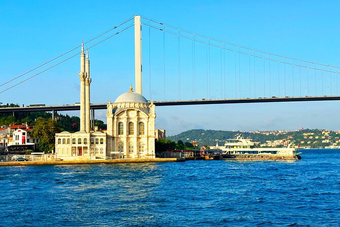 Bosphorus & Golden Horn: Sunset Yacht Cruise with Expert Guide - Ortaköy Mosque beneath the first bridge