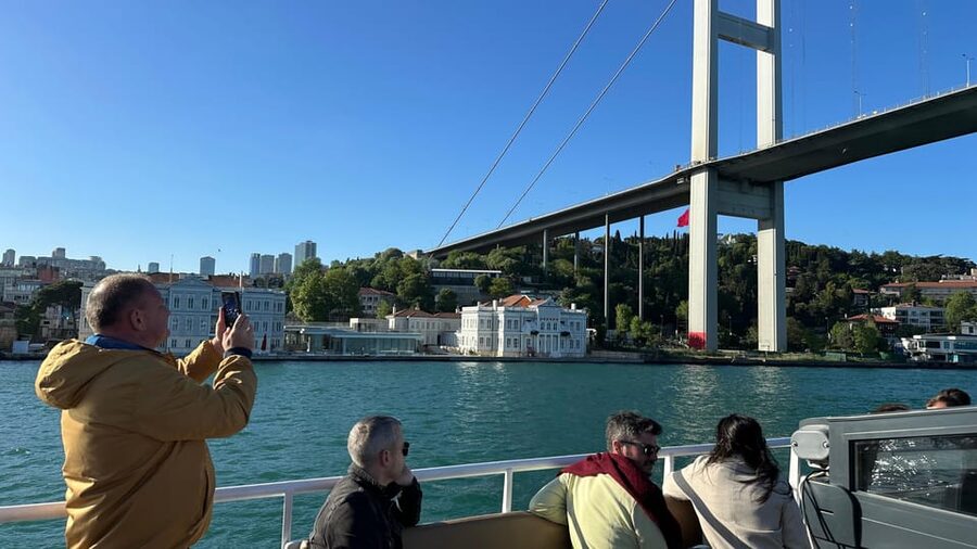 Istanbul: Daytime or Sunset Sightseeing Cruise & Audio Guide - Boarding at Karaköy and settling onto the yacht